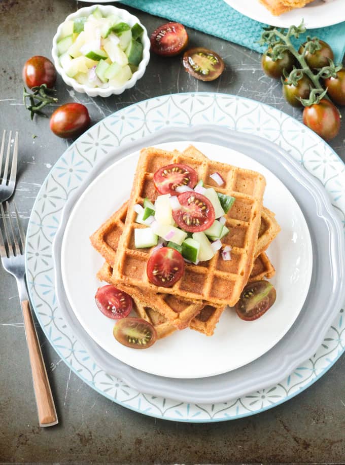 Vegan savory waffles topped with fresh pineapple cucumber salsa.