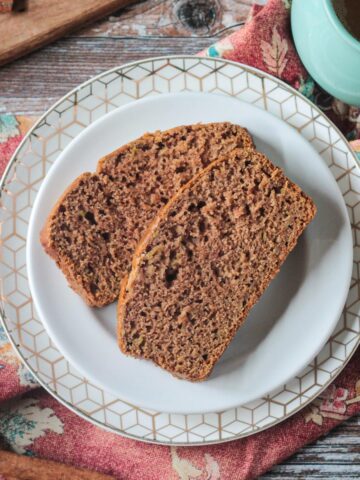 Two slices of apple cinnamon bread on a plate.