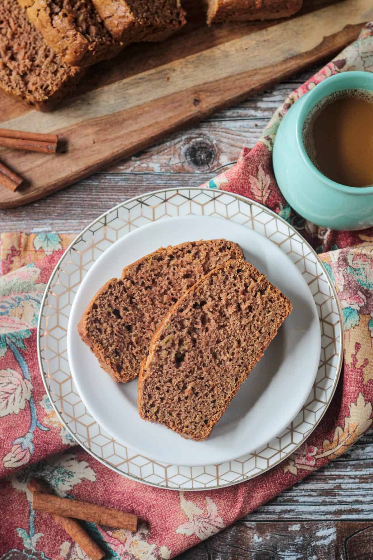 Two slices of apple cinnamon bread on a plate.
