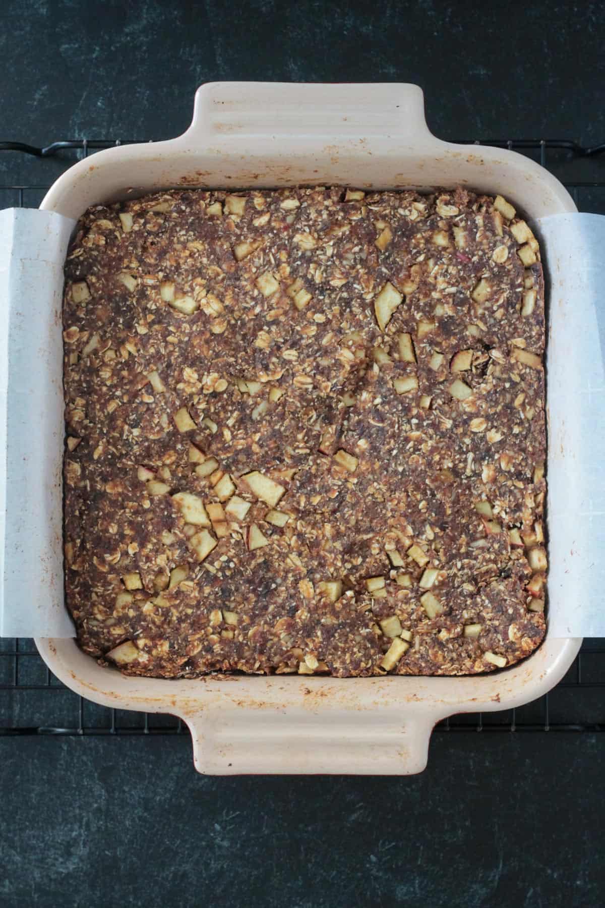 Date bars baked in a square baking dish.