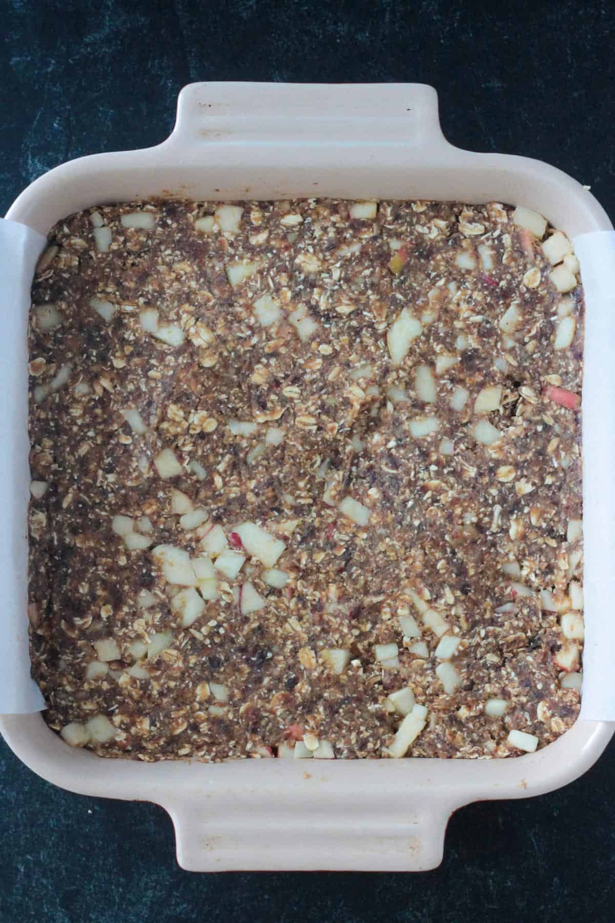 Raw mixture pressed into a square baking pan.