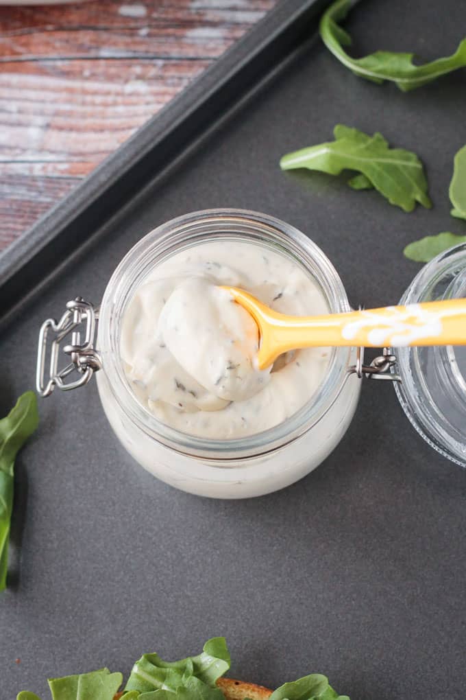 Small glass jar of healthy vegan thyme mayo