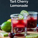 Three ice cubes floating in a glass of sparkling tart cherry lemonade.