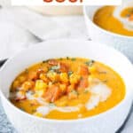 Bowl of butternut squash soup with corn.