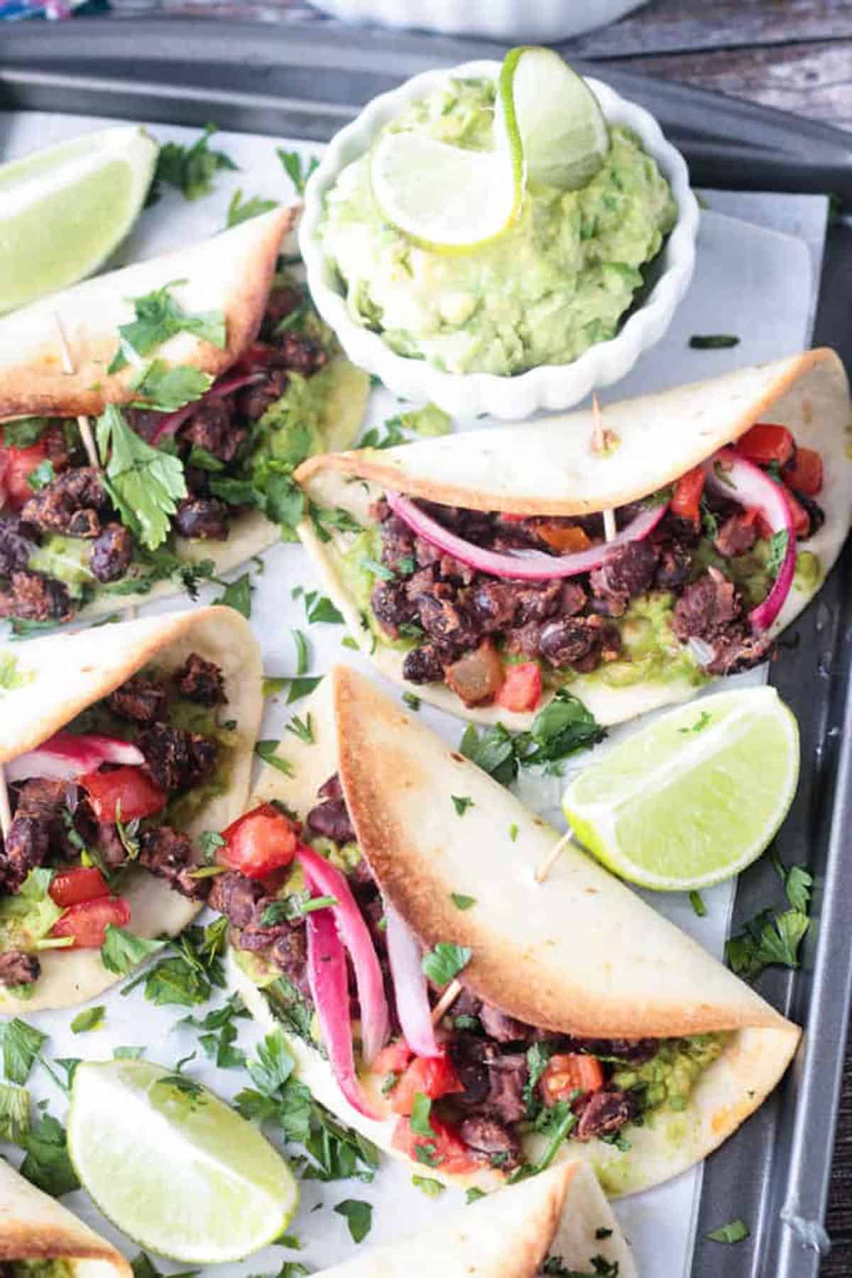 Close up of the black bean filling in baked taco shells.