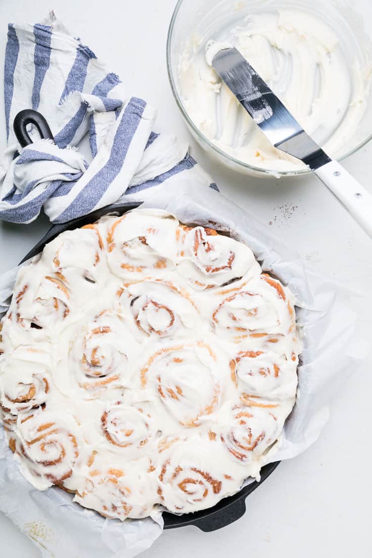 pan of frosted cinnamon rolls