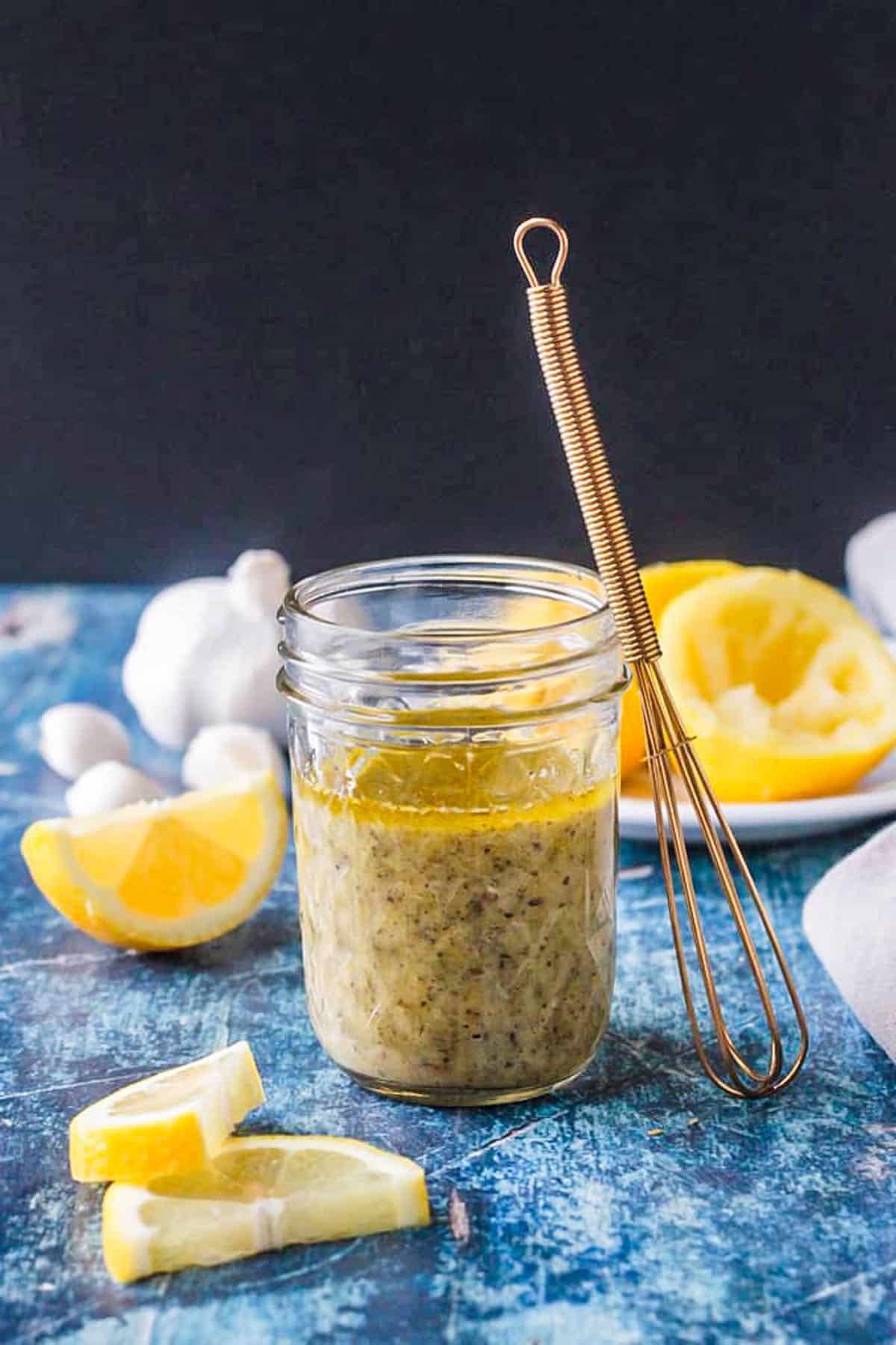 Jar of homemade lemon vinaigrette dressing.