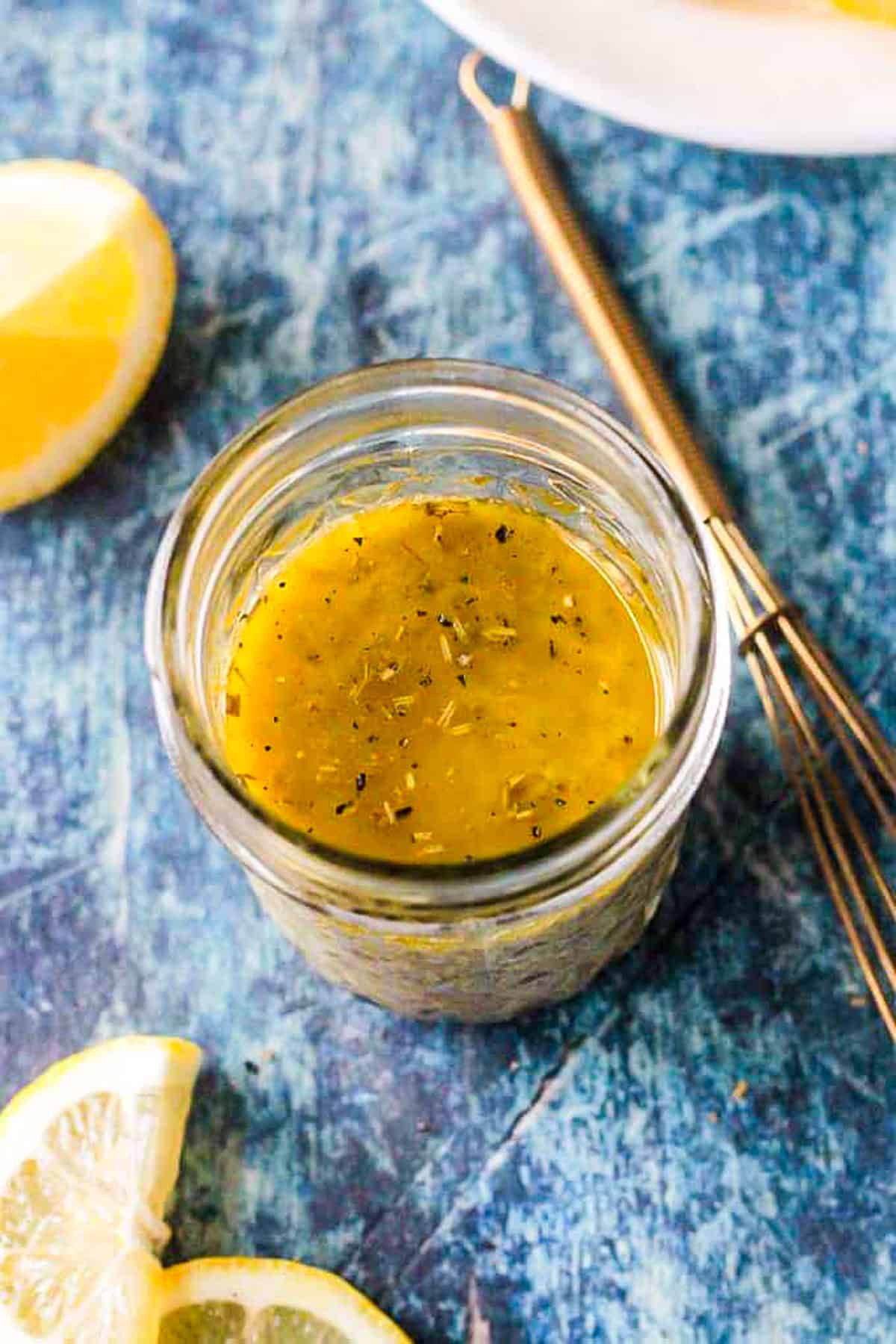 Overhead view of a jar of vinaigrette.