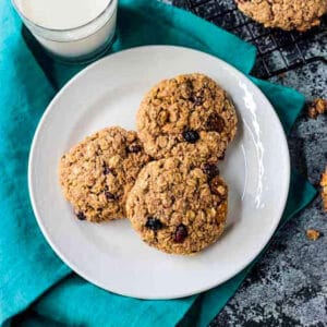 Three oatmeal breakfast cookies on a plate.