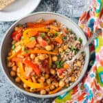 A bowl of Italian peppers and chickpeas over farro.