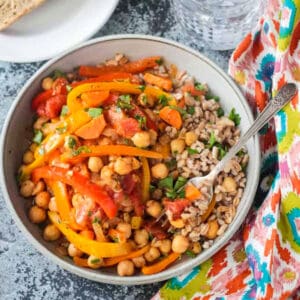 A bowl of Italian peppers and chickpeas over farro.