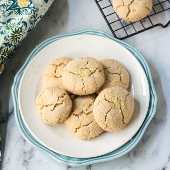 plate of lemon cookies topped with lemon zest