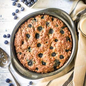 Blueberry breakfast cake baked in a round cake pan.