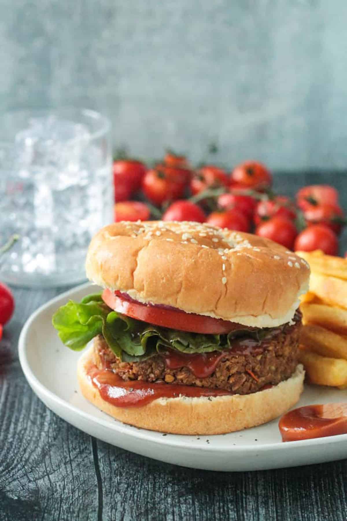 Burger on a bun with bbq squash squishing out.