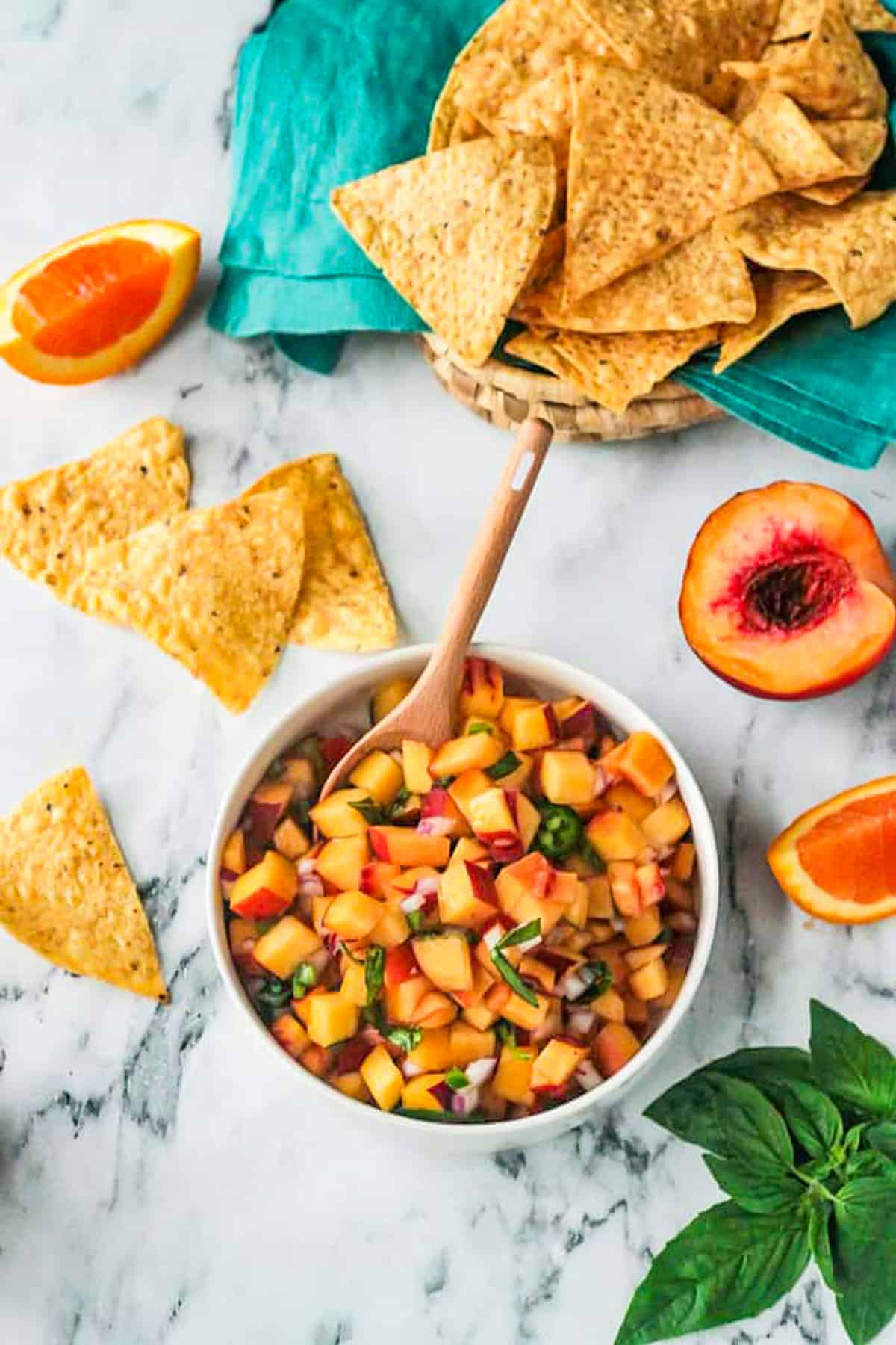 Fresh peach salsa with jalapeno, red onion, and basil.