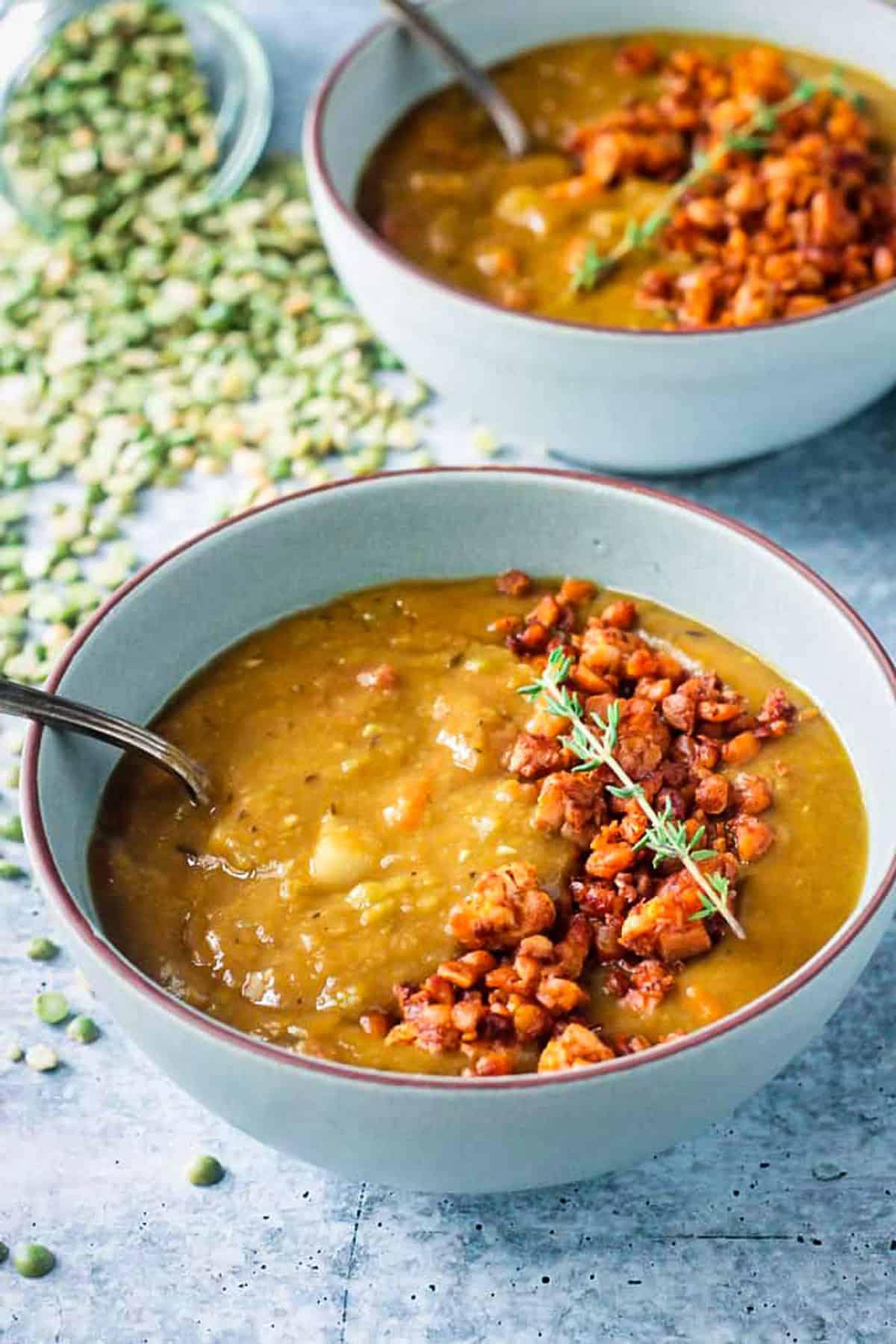 Spoon in a bowl of split pea soup.