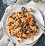 Fall Roasted Vegetable Pasta on a white plate with two forks.