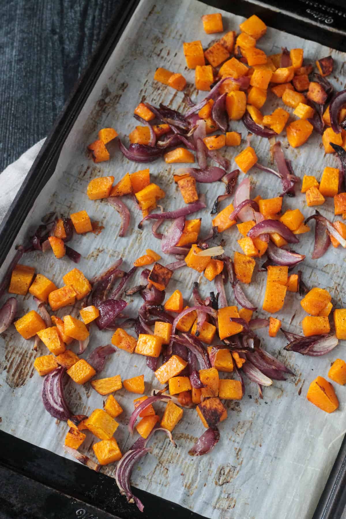 Roasted butternut chopped butternut squash and red onions.