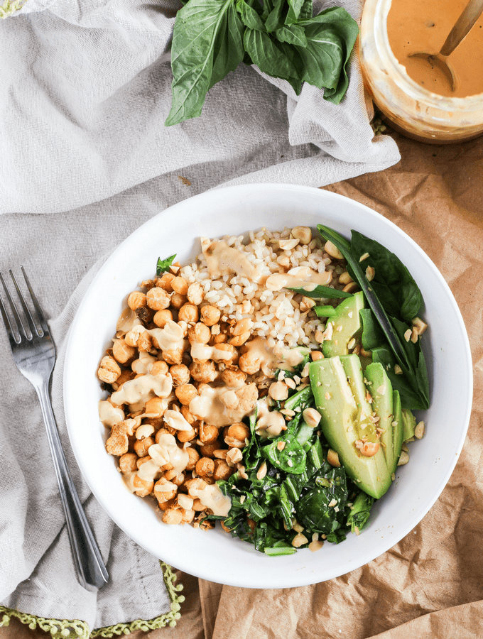 greens, beans, and rice bowl with avocado