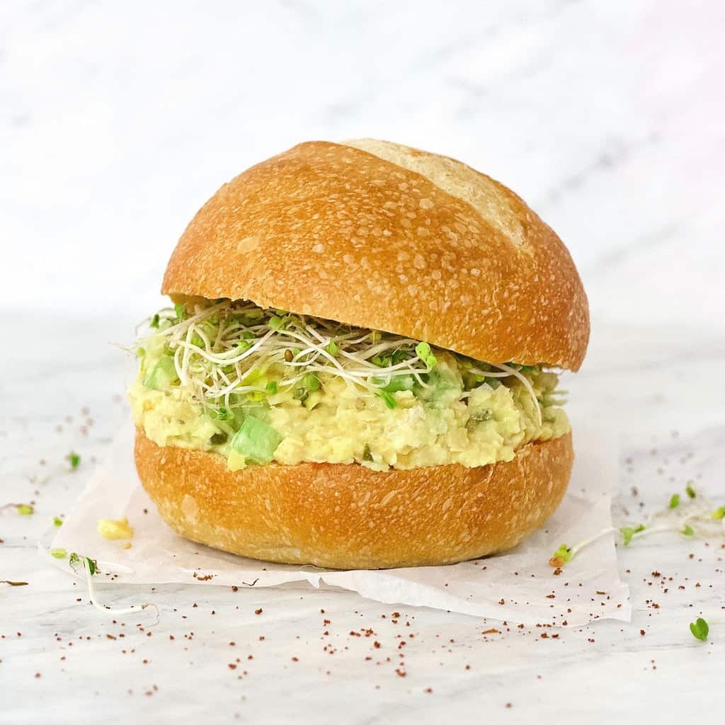 vegan tuna salad on a bun with sprouts