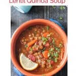 Overhead view of a bowl of soup with lentils, quinoa, carrots, tomatoes, and parsley.