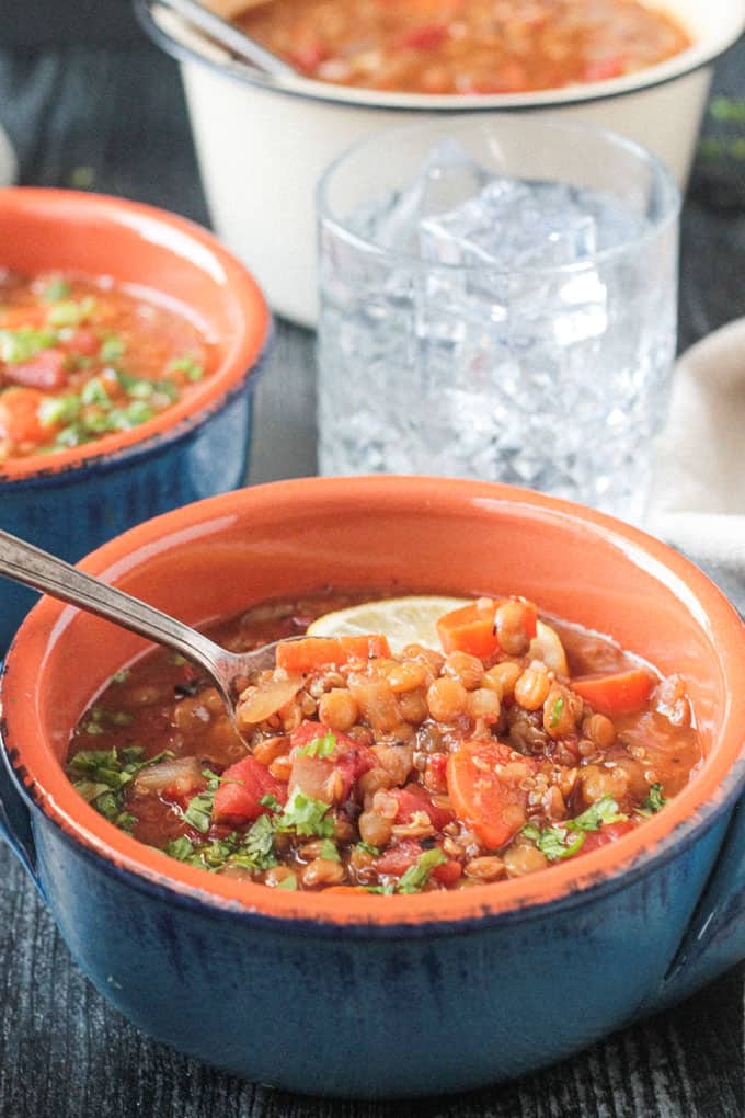 Spoonful of soup being lifted out of a bowl