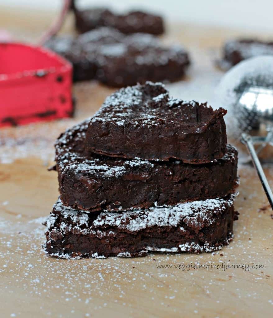 stack of three black bean brownies in the shape of hearts