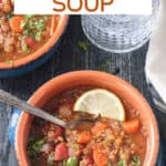 Lentil Quinoa Soup in a bowl with a spoon.