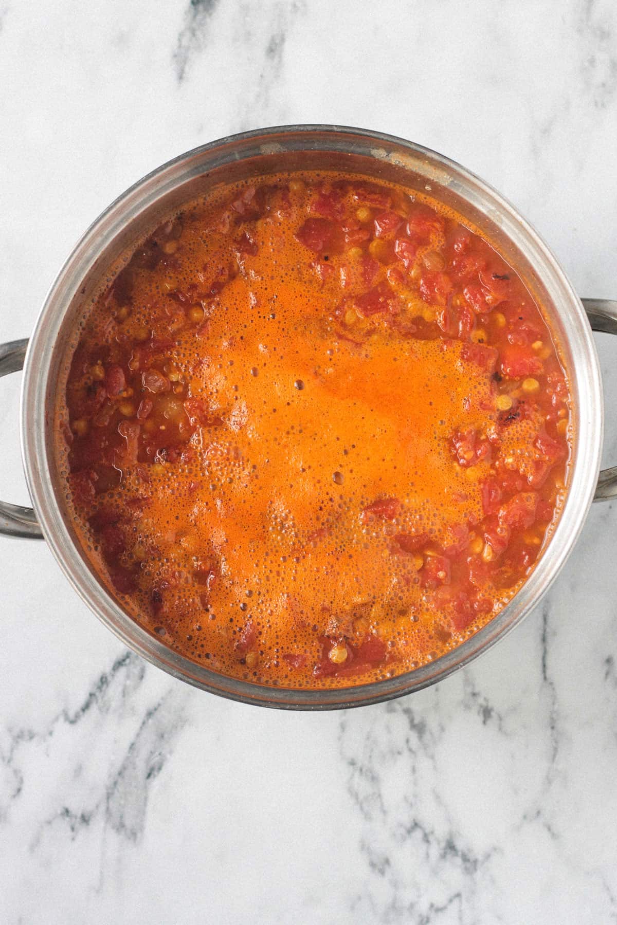 Soup after simmering in a pot on the stove.