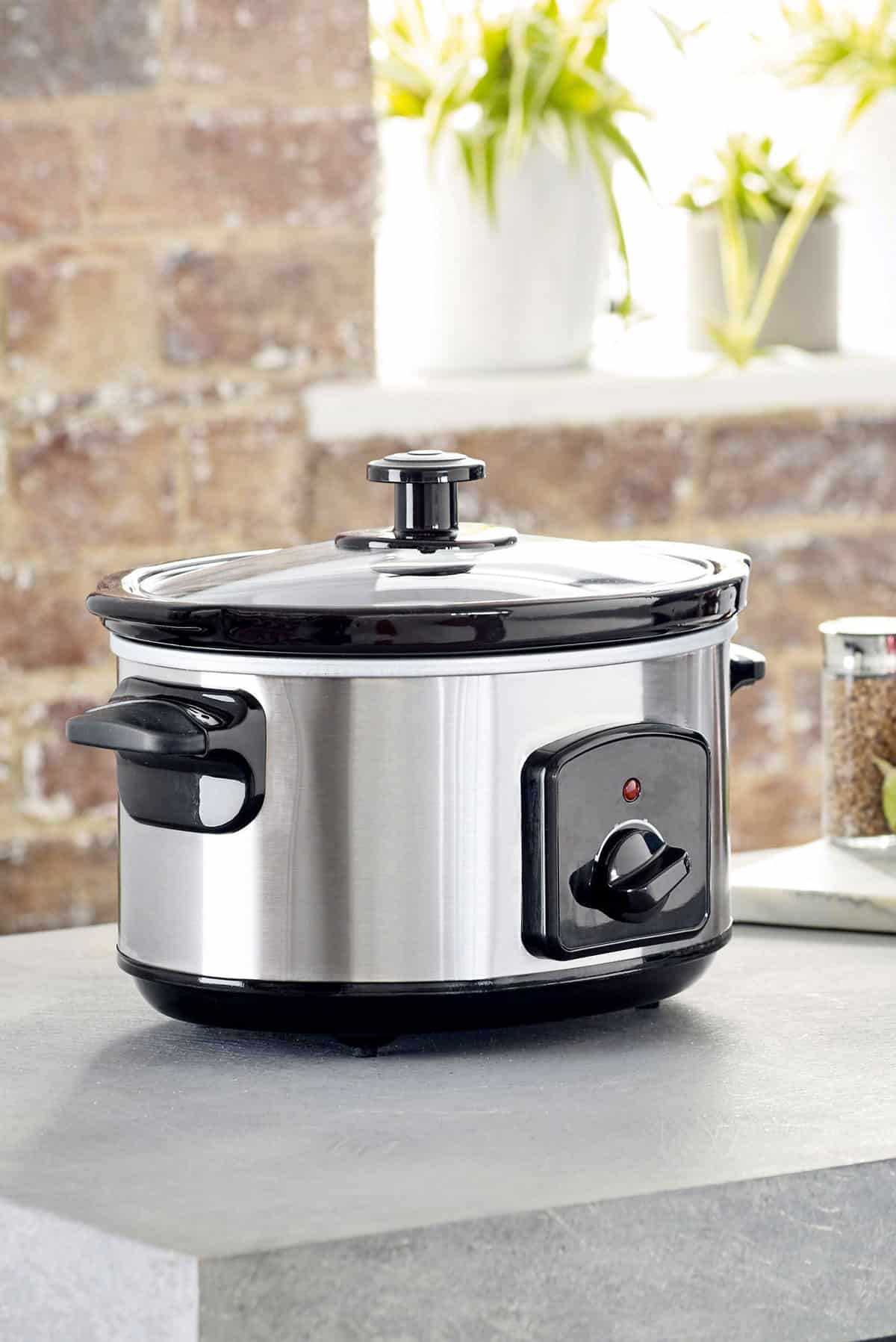 Slow cooker kitchen appliance on a counter top.