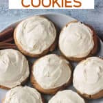Frosted sugar cookies on a plate.