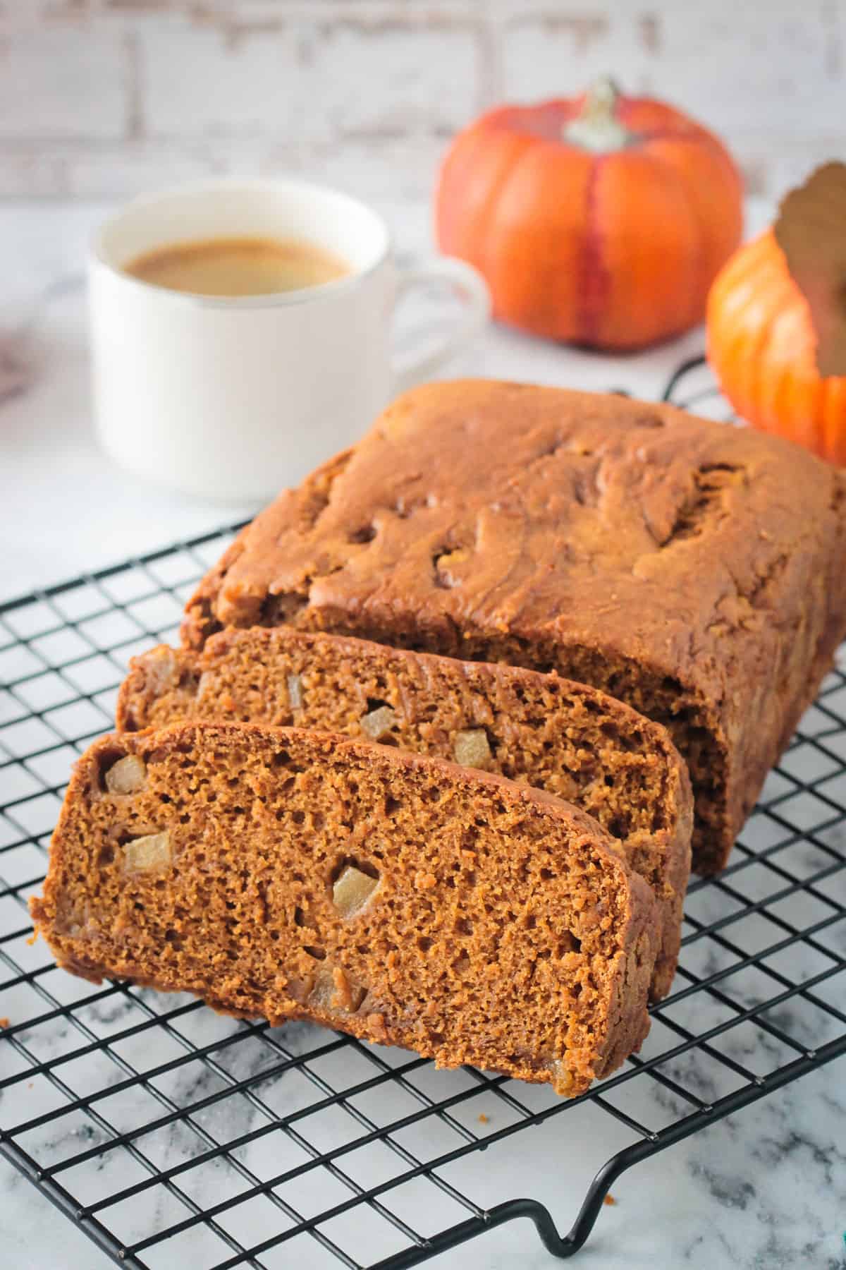 Close up of a slice of pumpkin bread with diced pears.