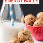 Three oatmeal peanut butter balls stacked next to a glass of milk.