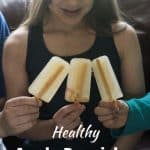 Young girl with three popsicles.