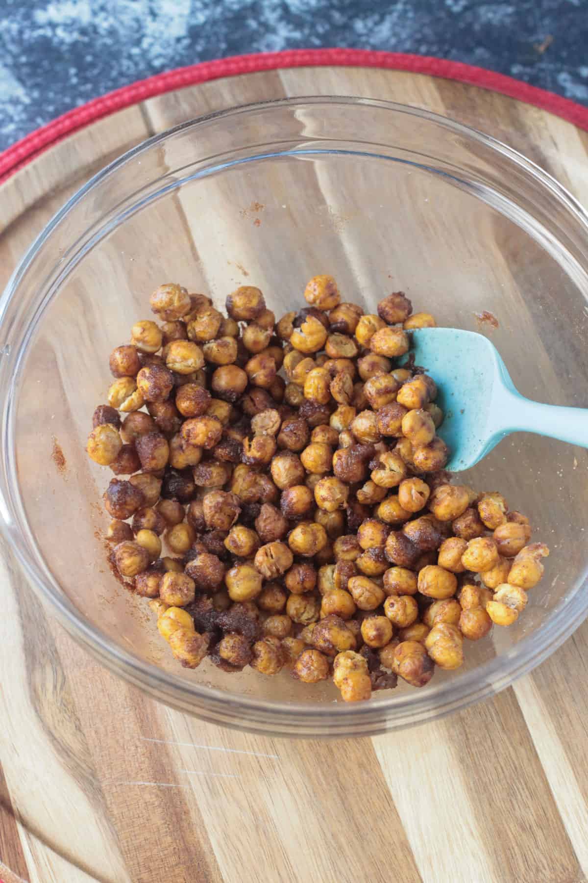 A bowl of roasted chickpeas tossed in maple syrup.
