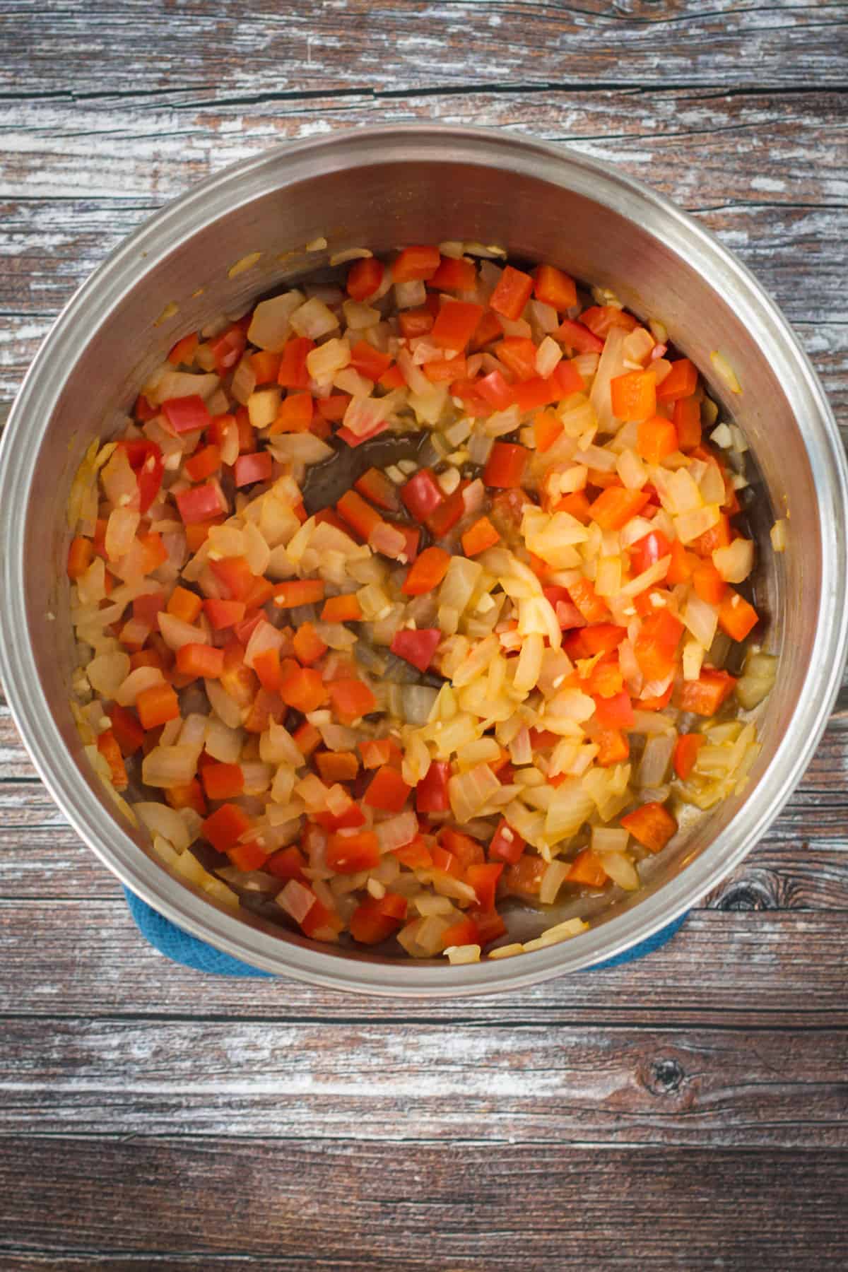 Sautéed aromatics in a soup pot.