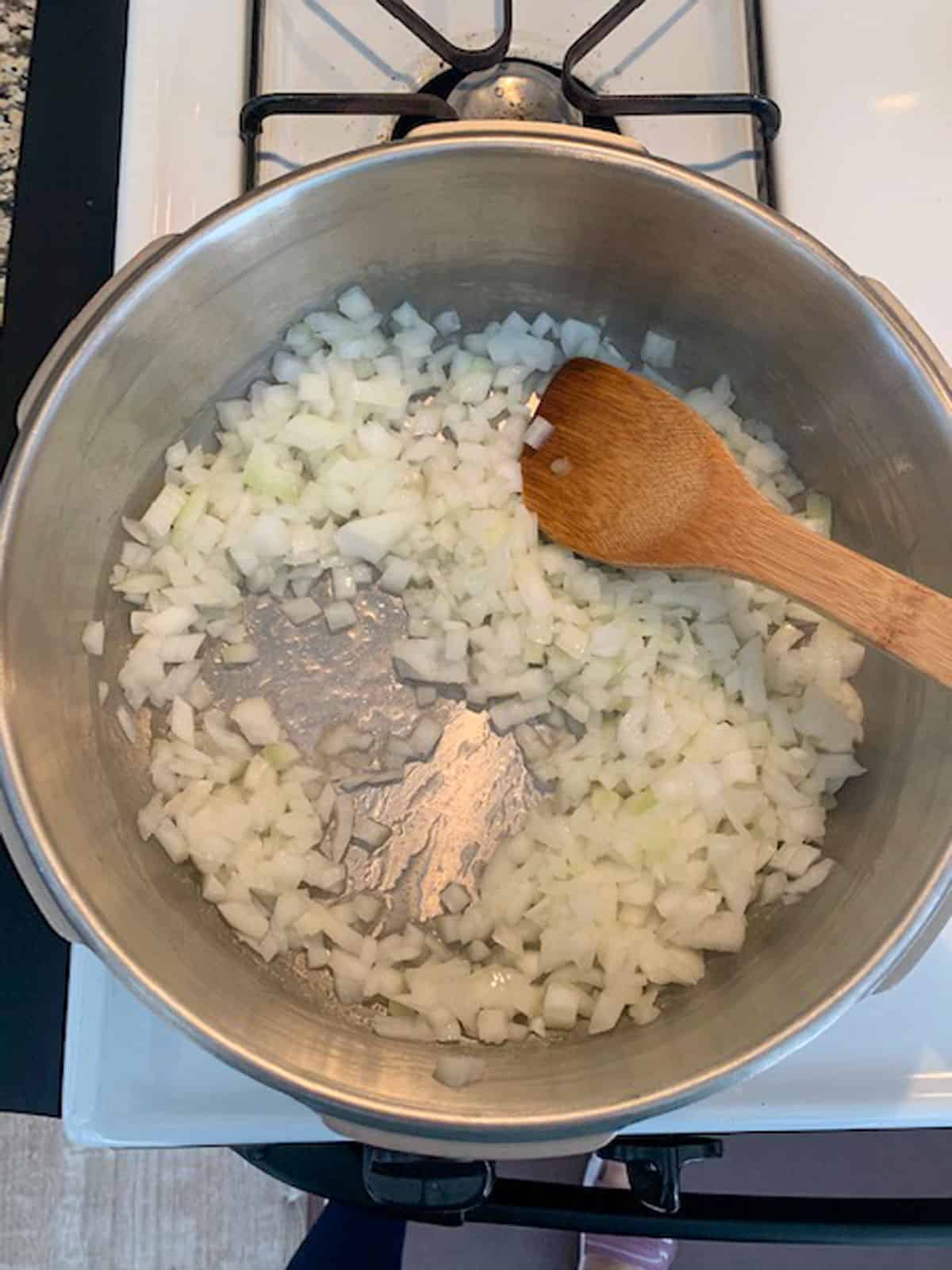 Sautéing onions in a soup pot.