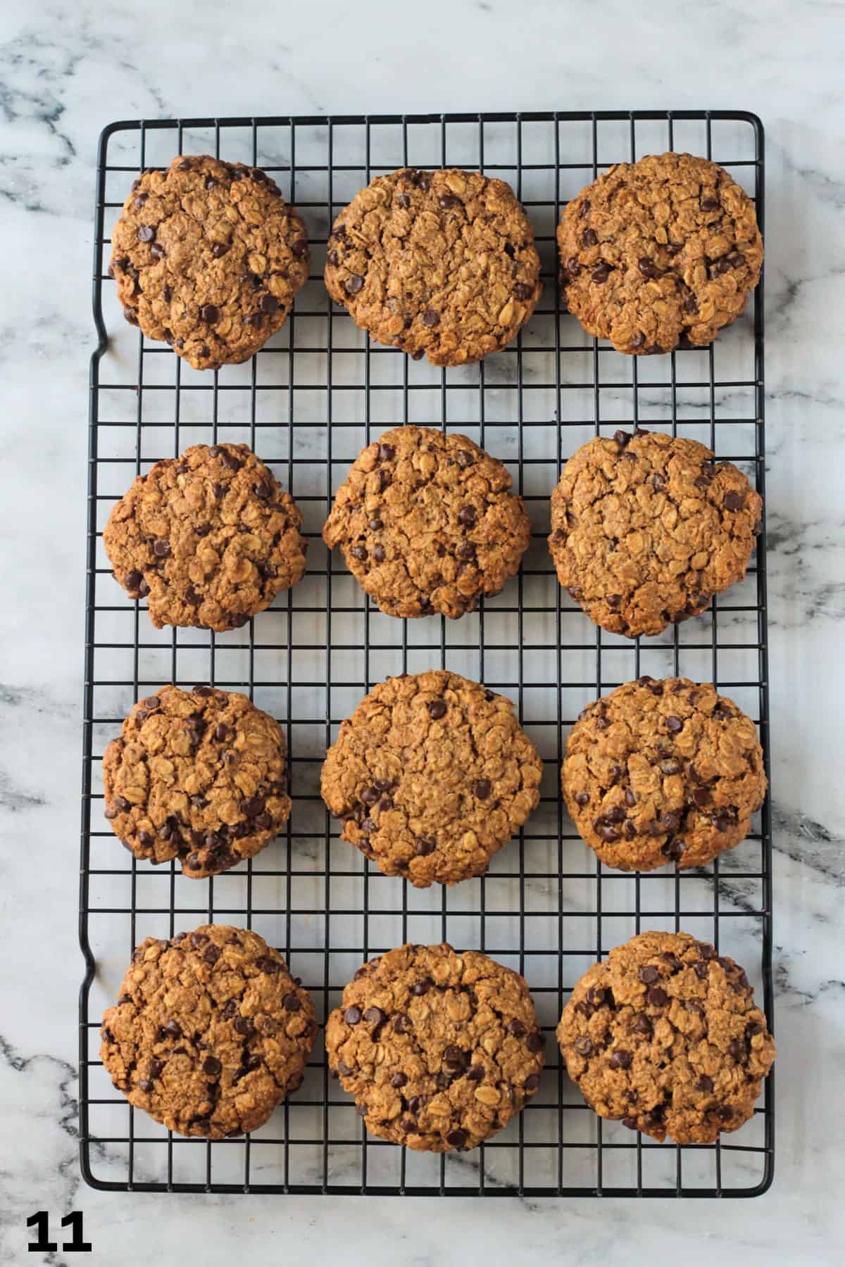 12 oatmeal chocolate chip cookies cooling on a wire rack.