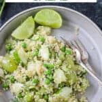 Vegan quinoa salad with green grapes, peas, cucumber, and fresh herbs.