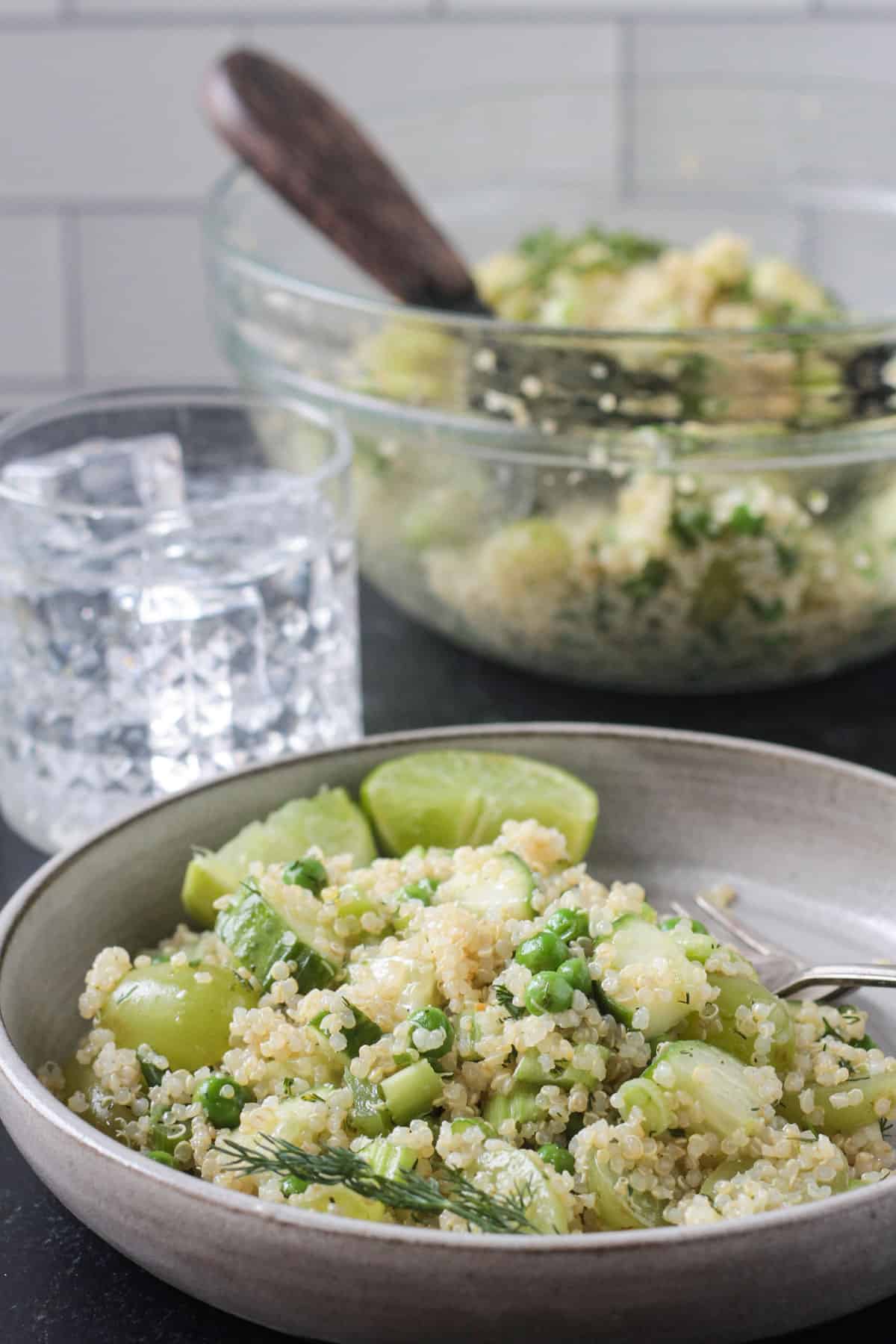 Gray flat bowl holding quinoa salad.