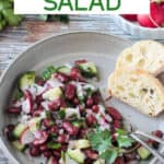 Red kidney bean salad with radishes, cucumber, and parsley.