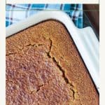 Overhead of a baked pan of cornbread with a golden brown crackly top.