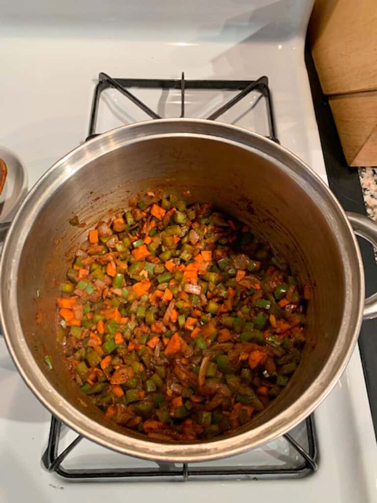 Sautéed onions, peppers and carrots mixed with the chili spices.
