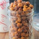 Close up view of crunchy chickpeas in a glass jar.