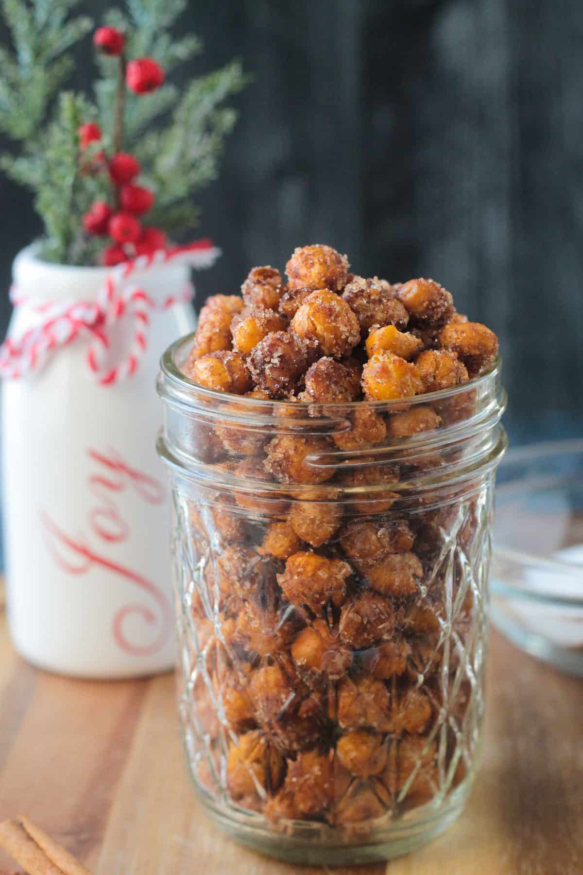 Close up view of crunchy chickpeas in a glass jar.