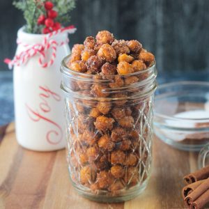 Chickpeas dusted with cinnamon sugar in a glass jar.