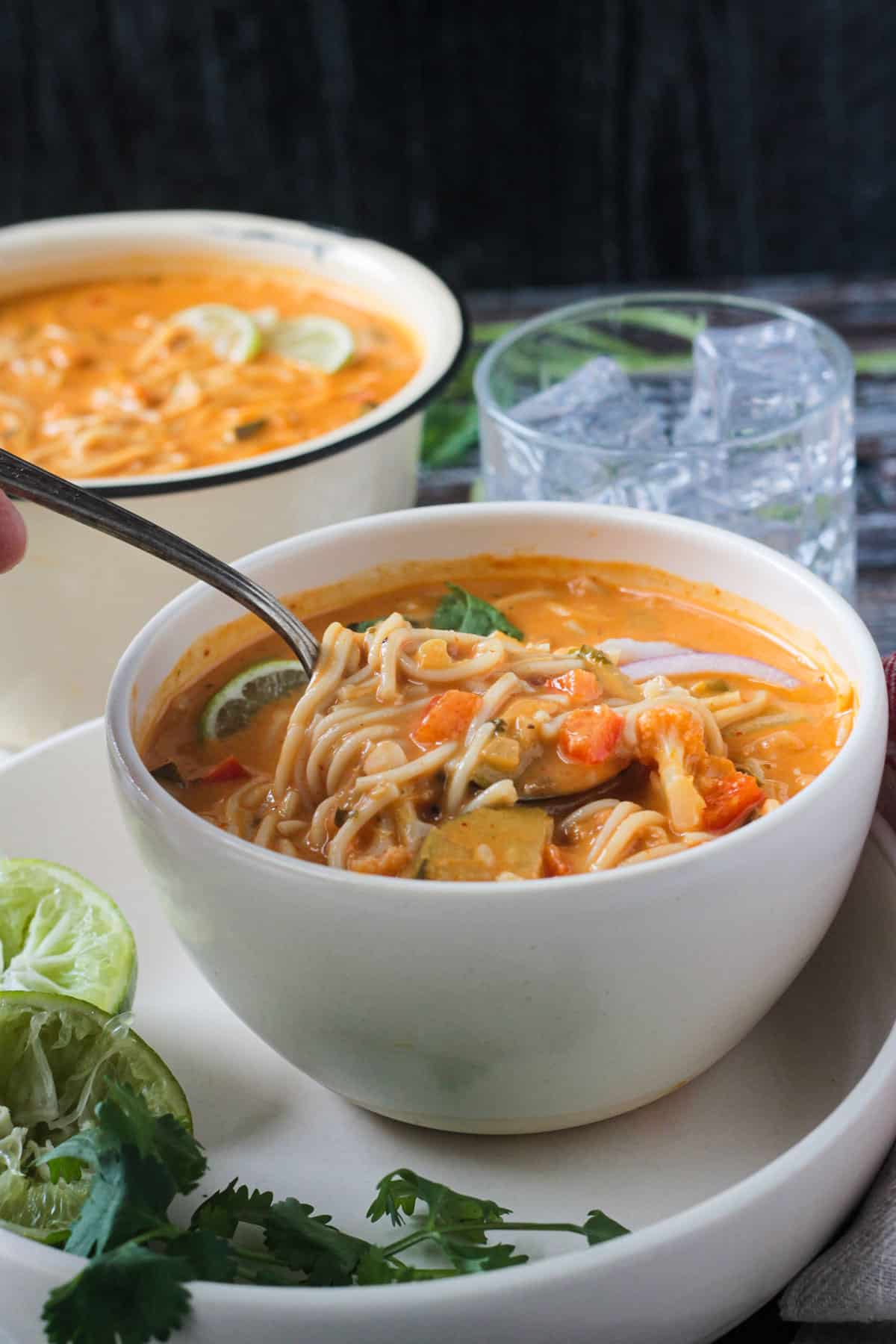 Spoonful of soup being scooped out of a bowl.