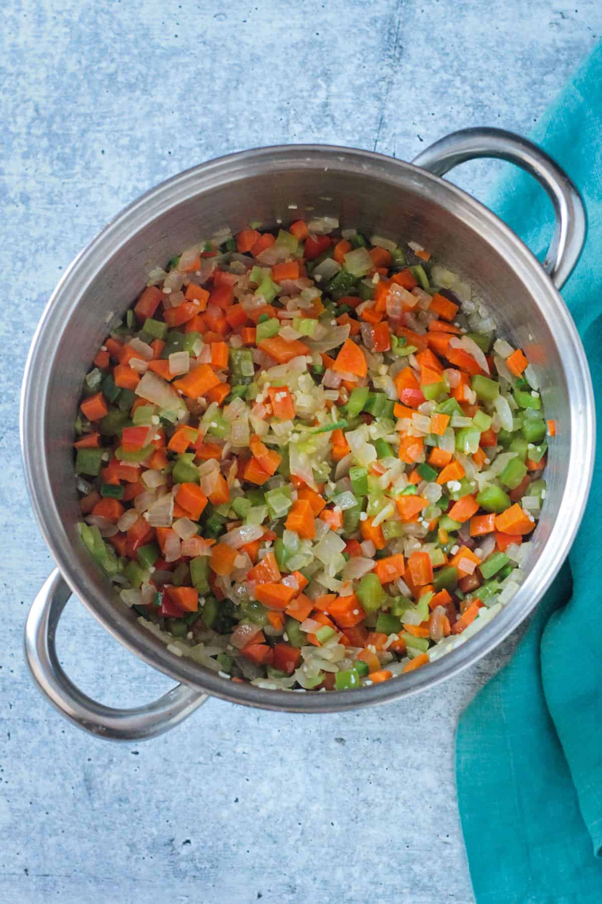 Diced celery and carrots added to the pot.