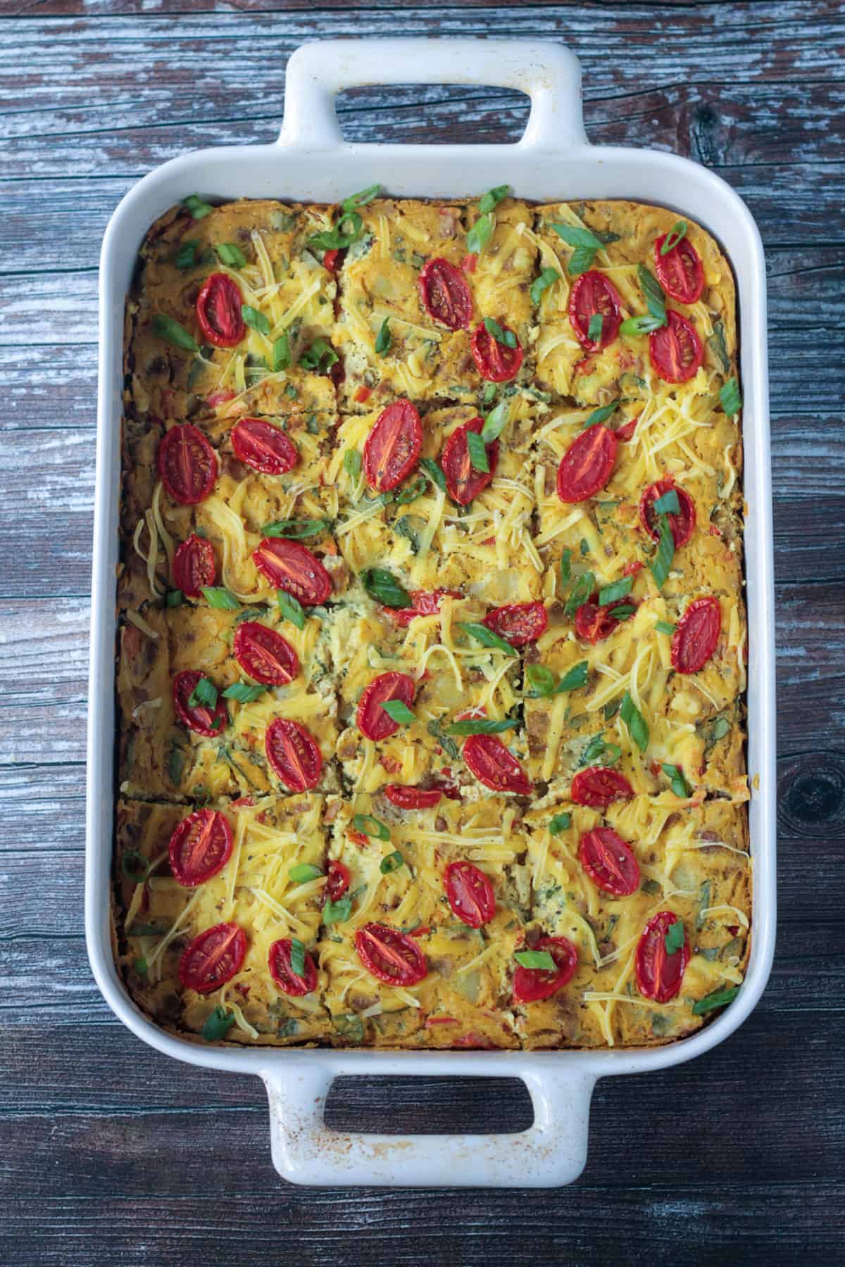Finished vegan egg casserole cut into12 squares in the baking dish.