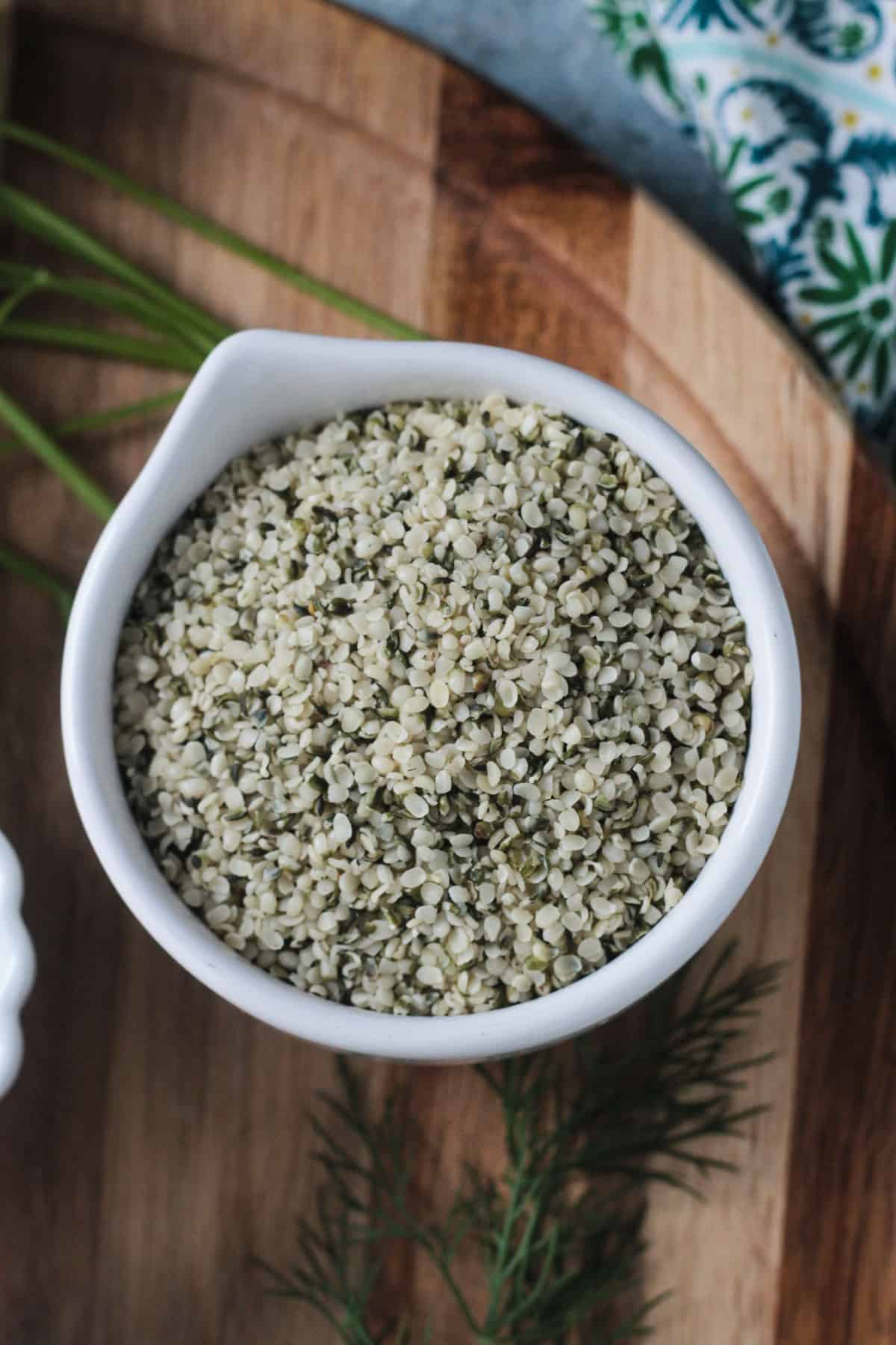 Close up overhead view of a bowl full of hemp seeds.